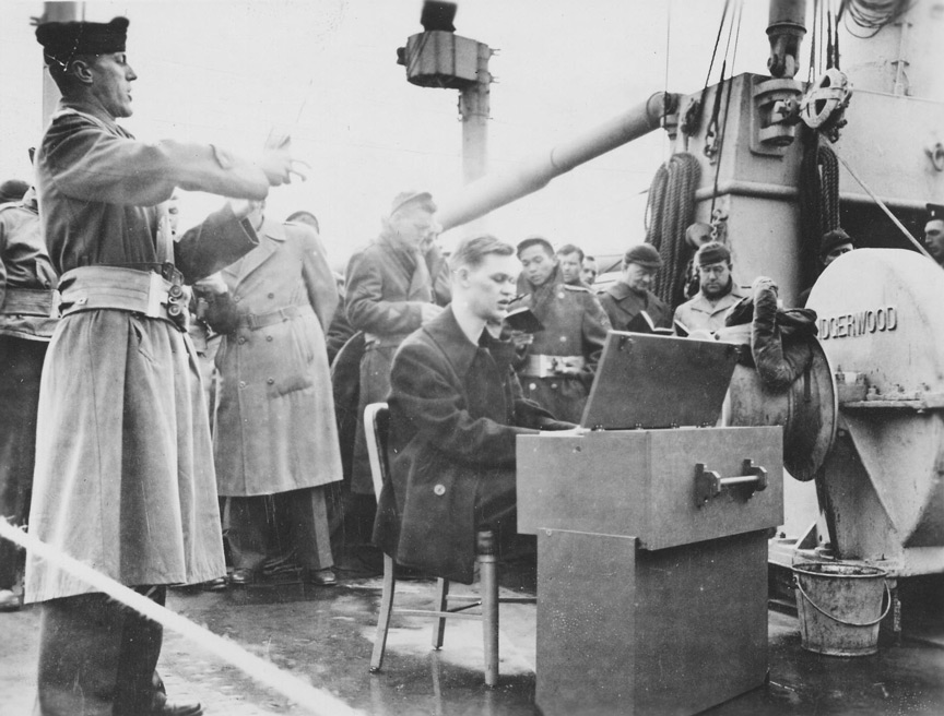 Chaplain Duvall Conducting Services on USS Wakefield - 16 April 1944 