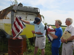 Randy burning worn 398th Flags at Ceremony