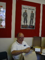 Ken looking over 398th memorabilia